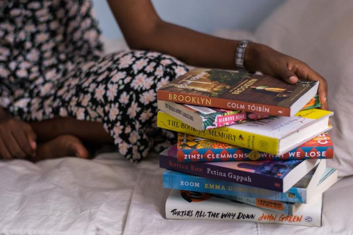 Stack of books on the bed