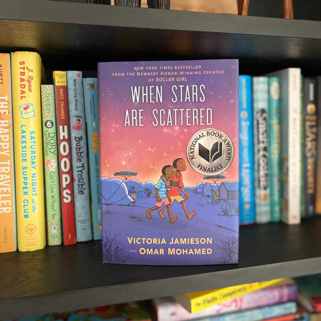 where stars are scattered stands facing out on a shelf with other 6th grade readaloud books