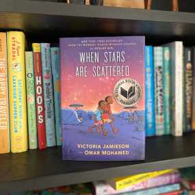 where stars are scattered stands facing out on a shelf with other 6th grade readaloud books