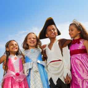 a group of kids in various book costumes