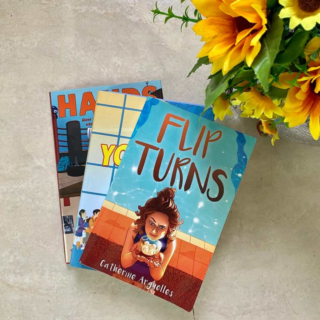 a stack of three books for 12 year olds including flip turns, you are here, and hands