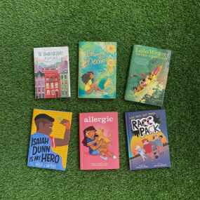 A spread of 6 books for 4th graders on green grass