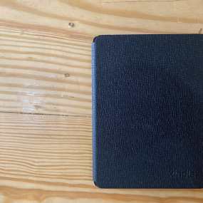 a black kindle on a table - is kindle unlimited worth it
