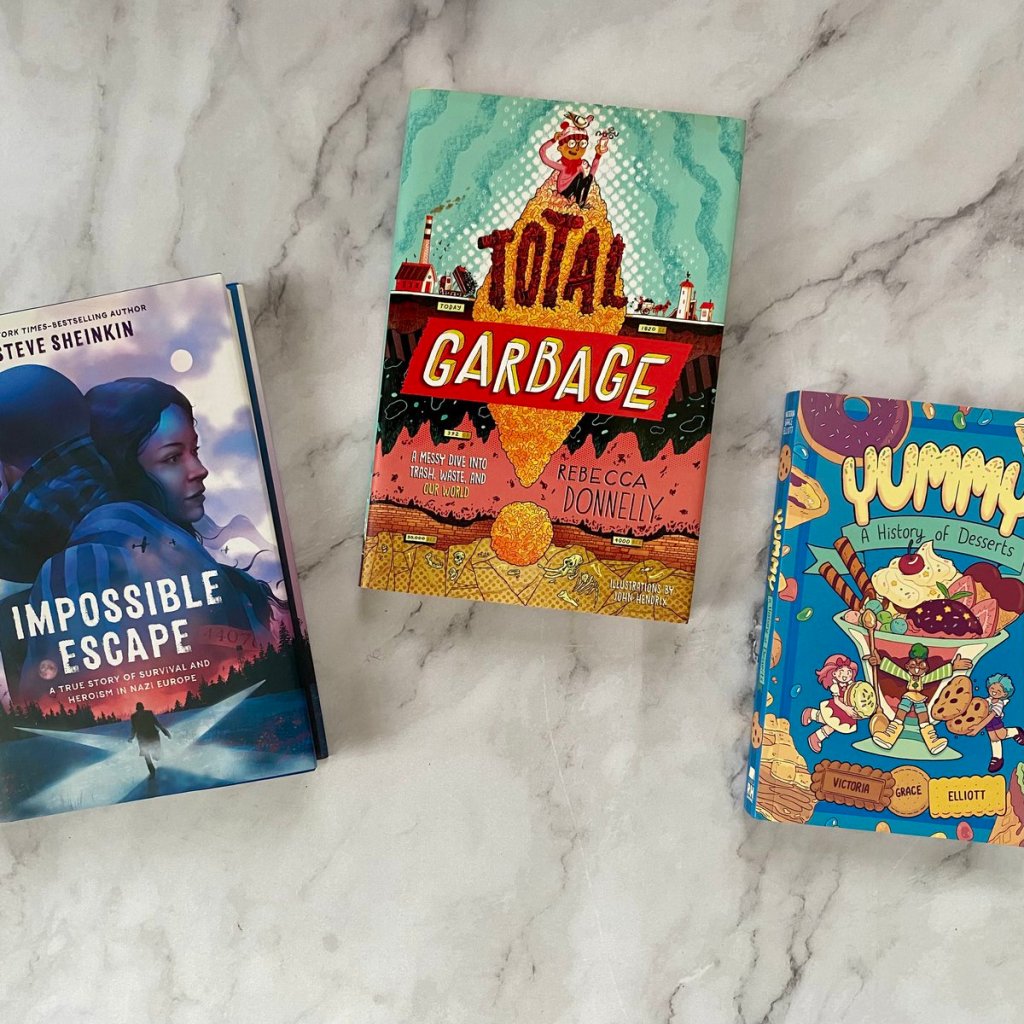 3 middle school nonfiction books on a marble countertop