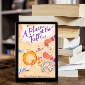 tablet shows the cover of book a place at the table stacked against a set of books