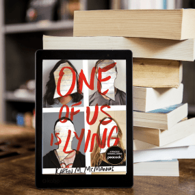 a kindle leaning against a stack of books shows the cover of karen mcmanus's one of us is lying