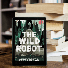 an ereader showing the wild robot cover leans on a stack of books